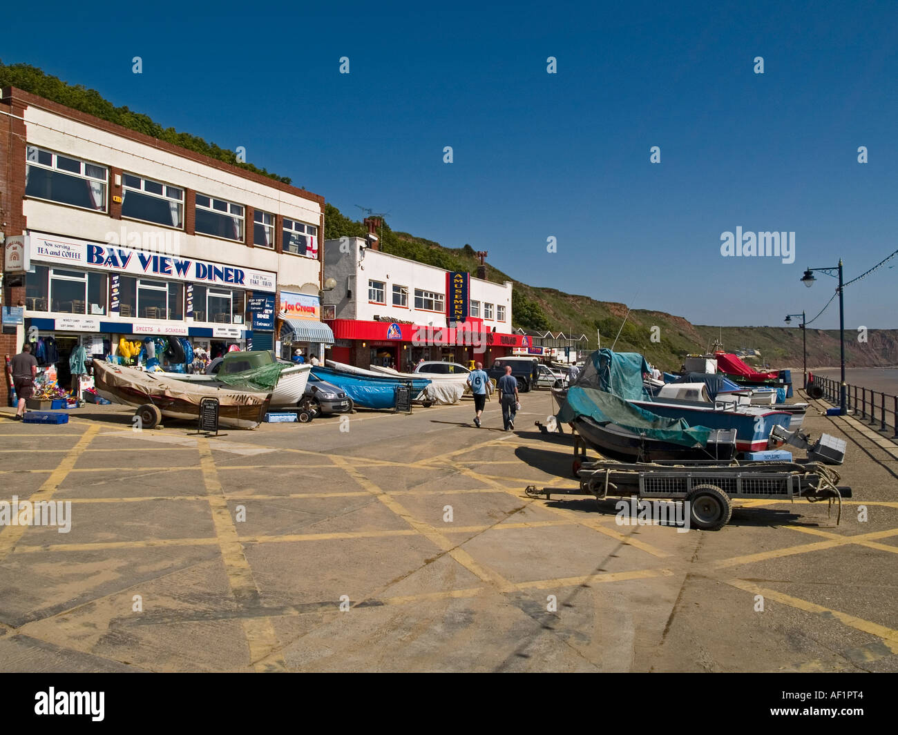 At Filey North Yorkshire UK the typical seaside resort amusements are all in a small area at the North end of the seafront Stock Photo