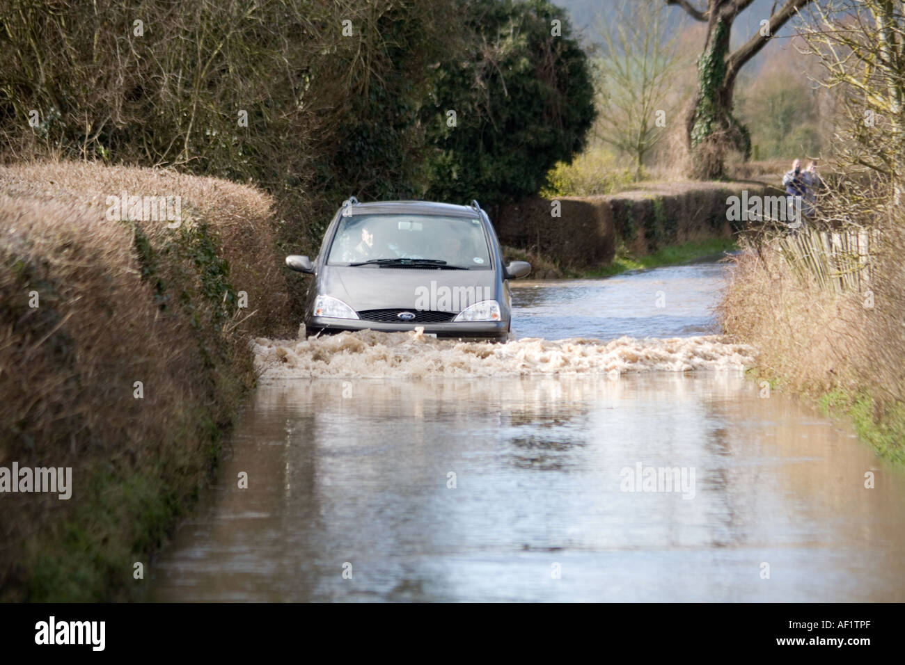 Rising flood waters after the Severn Bore has passed in the lane at Stonebench, Gloucestershire Stock Photo