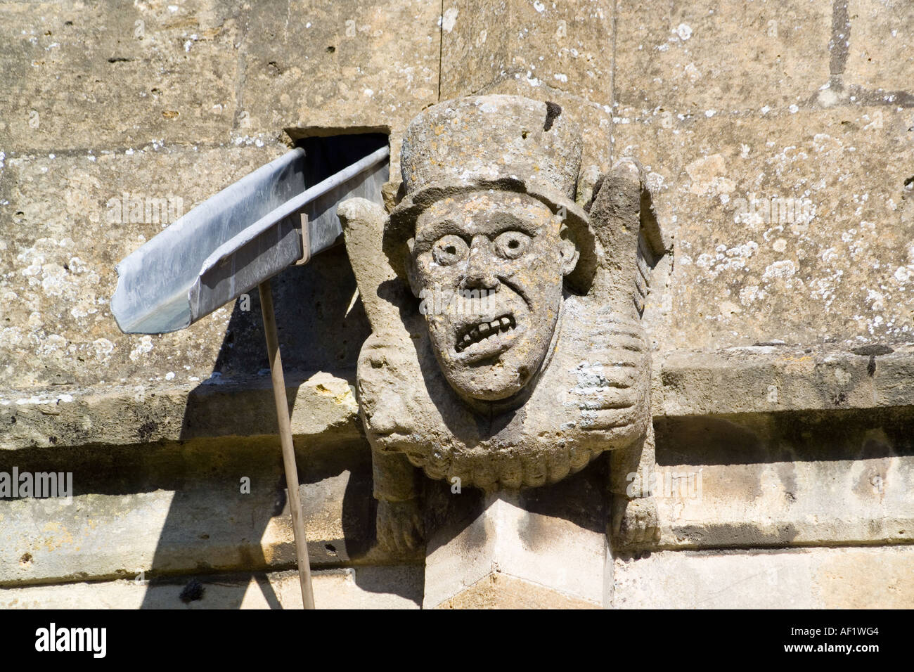 Medieval gargoyle on St Peters church (1465) in the Cotswold town of Winchcombe, Gloucestershire Stock Photo