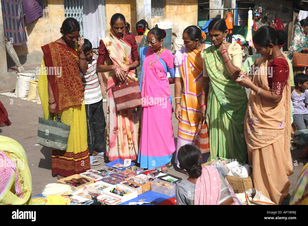 A group of  Indian females shopping at jewellery stall in market, Vanakbara Fishing Village, Diu Island, Gujarat, India Stock Photo