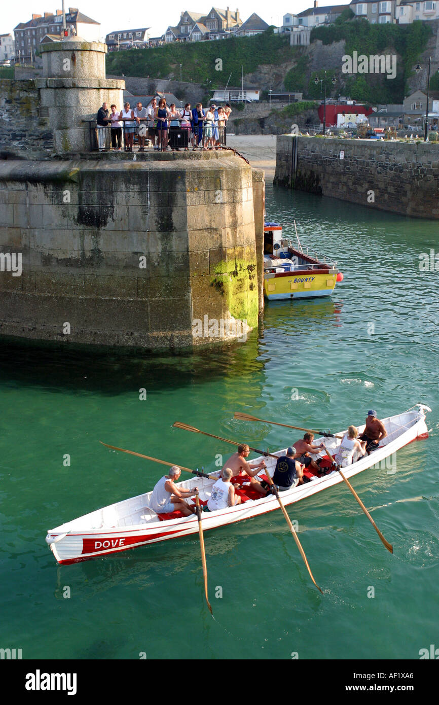 Pilot gig leaving the harbour at Newquay Cornwall UK Stock Photo