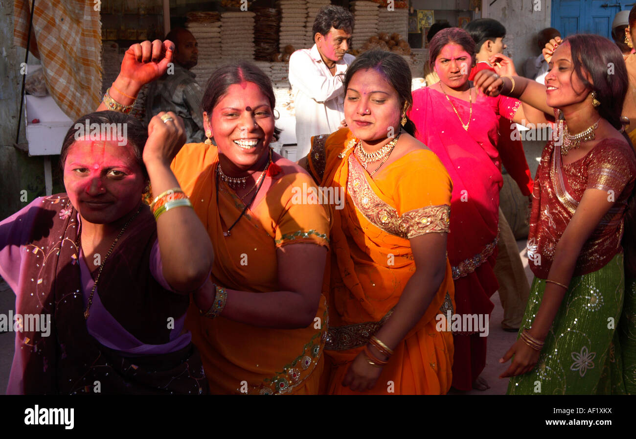 Indian women dancing celebrating holi festival of colours, Dwarka, Gujarat, India Stock Photo
