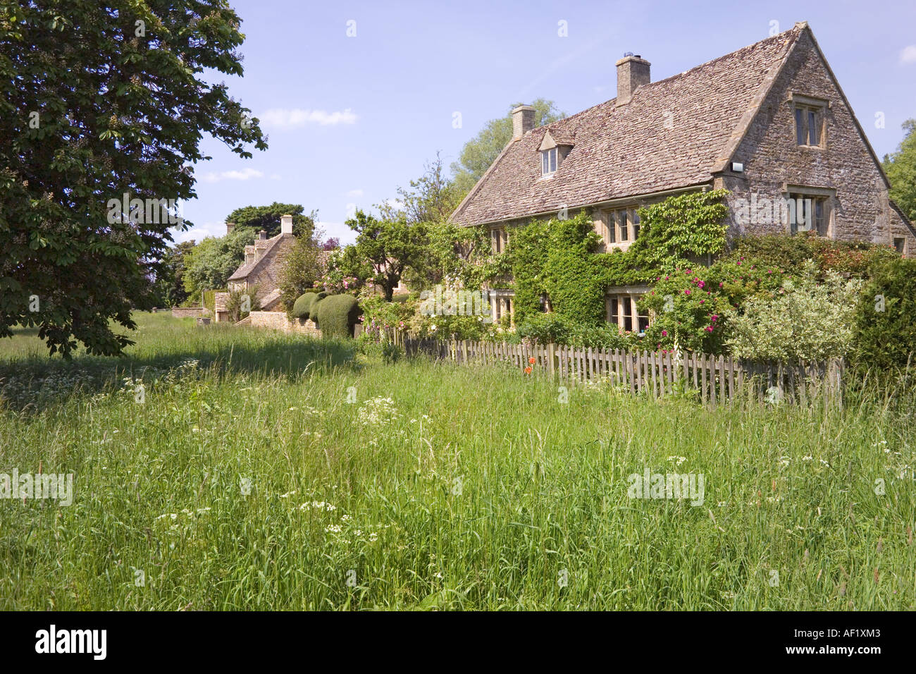 Cottages on the village green in the Cotswold village of Wyck