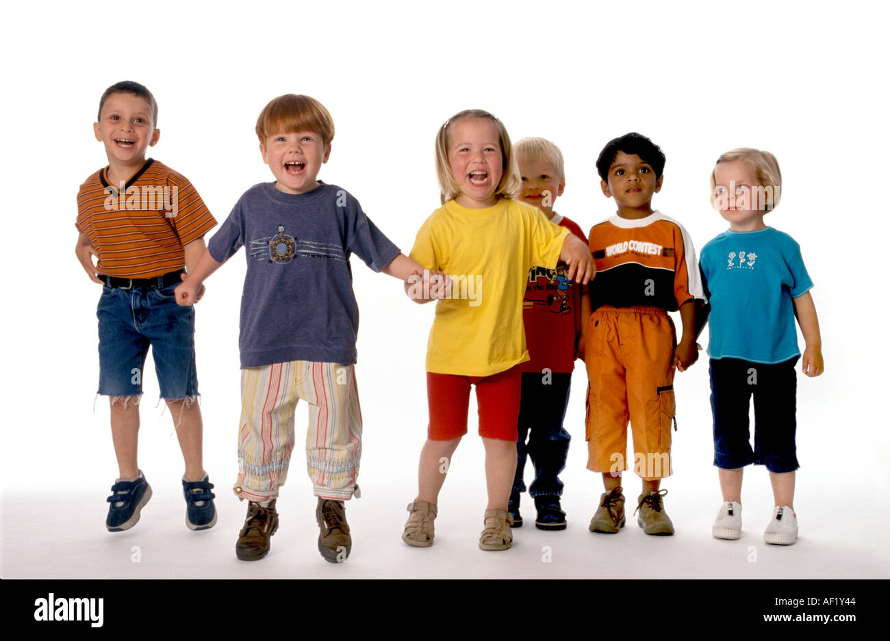 Group of six children in a row in the studio Stock Photo Alamy