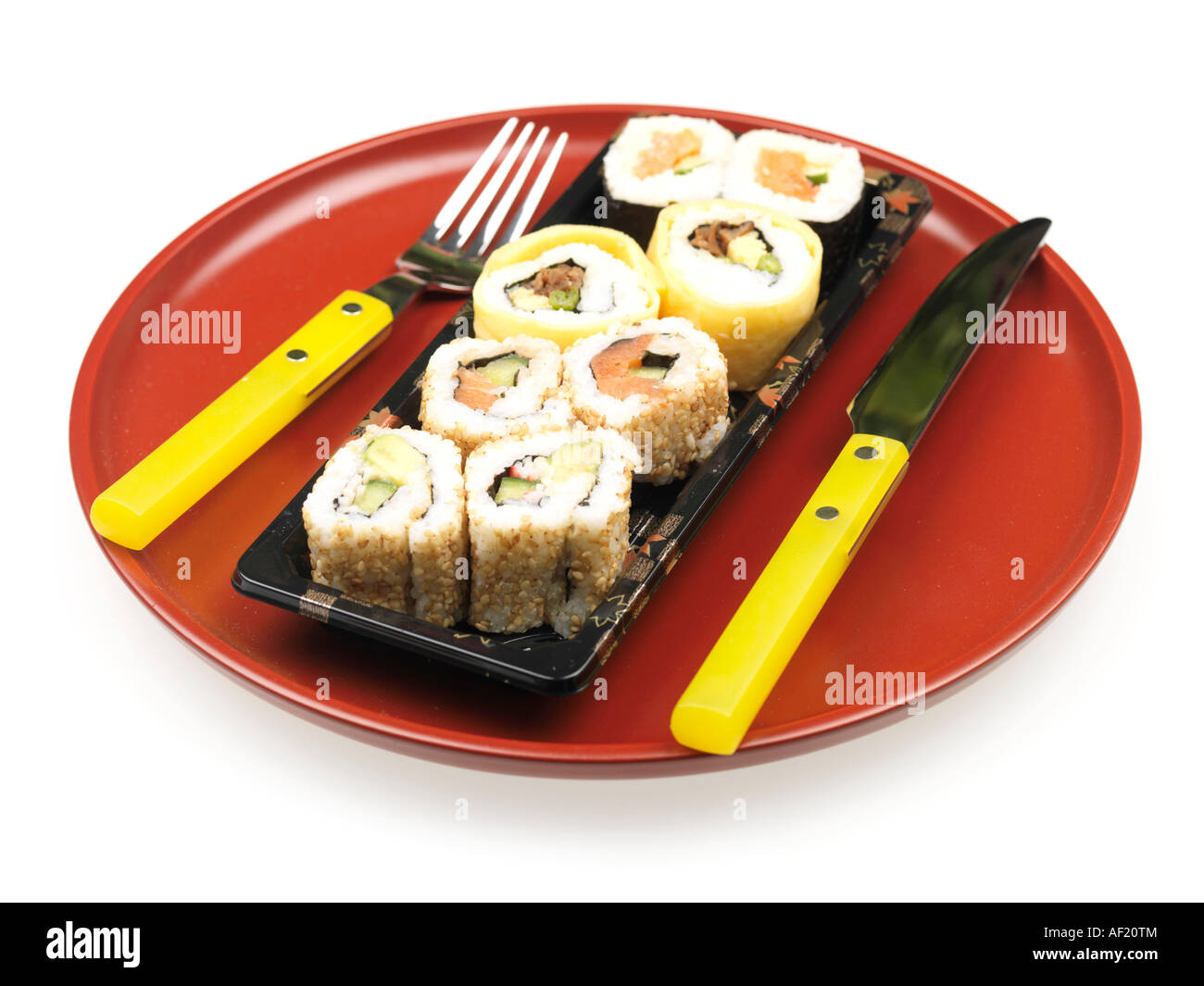 Selection Of Assorted Shop Bought Colourful Japanese Style Sushi Snacks Isolated Against A White Background With No People And A Clipping Path Stock Photo