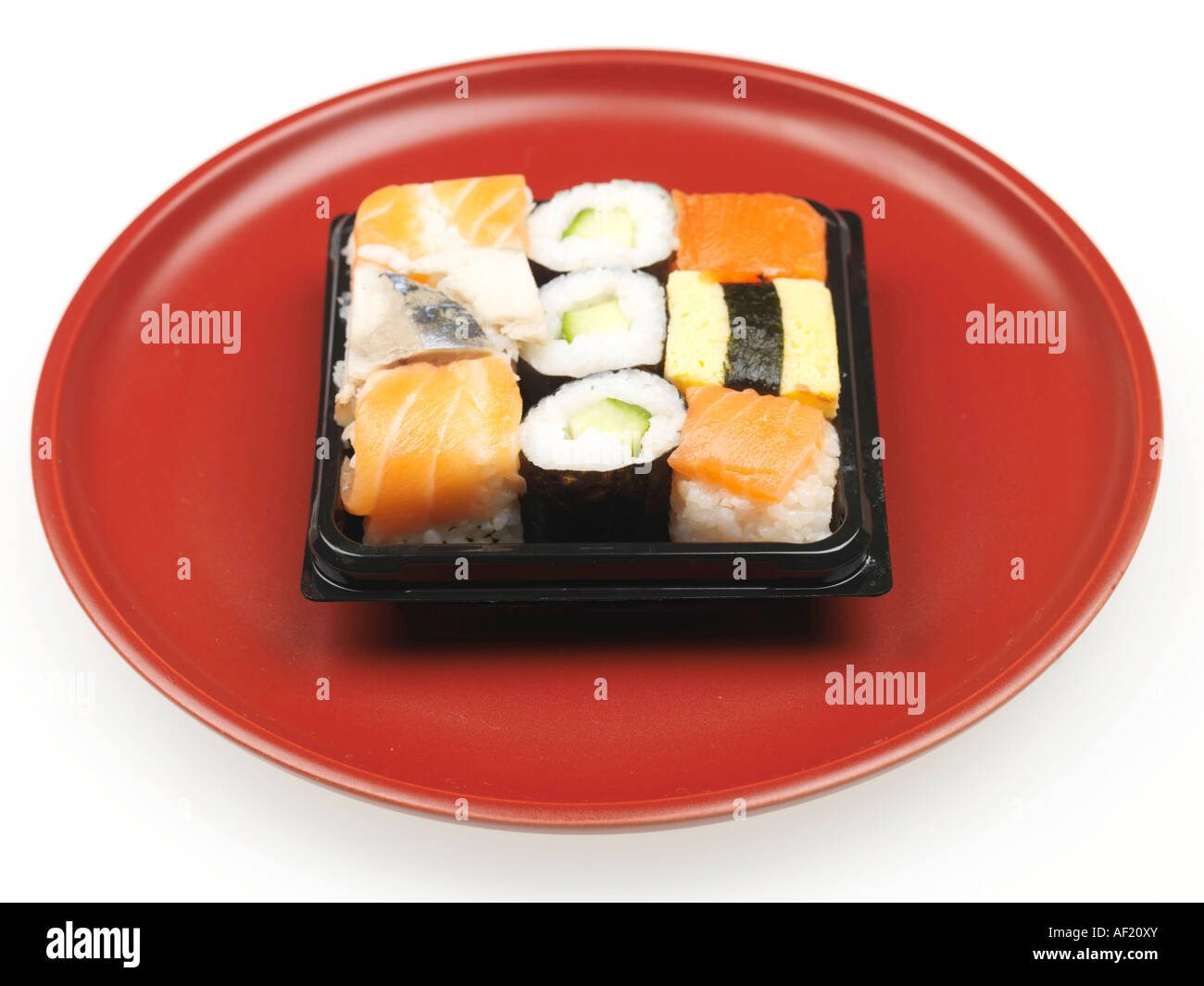 Selection Of Assorted Shop Bought Colourful Japanese Style Sushi Snacks Isolated Against A White Background With No People And A Clipping Path Stock Photo