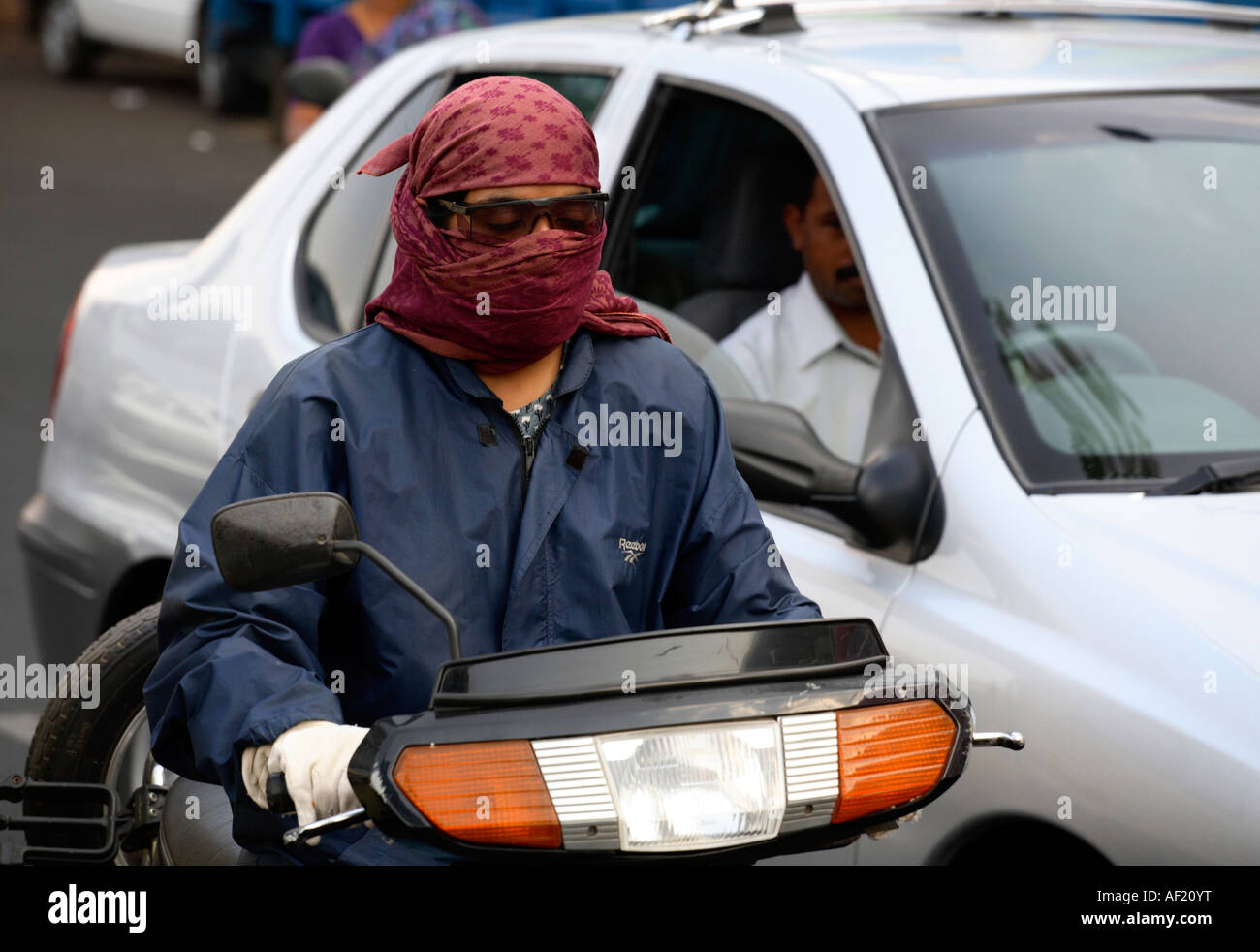 Indian female riding scooter without helmet in busy traffic, Pune, India Stock Photo Alamy