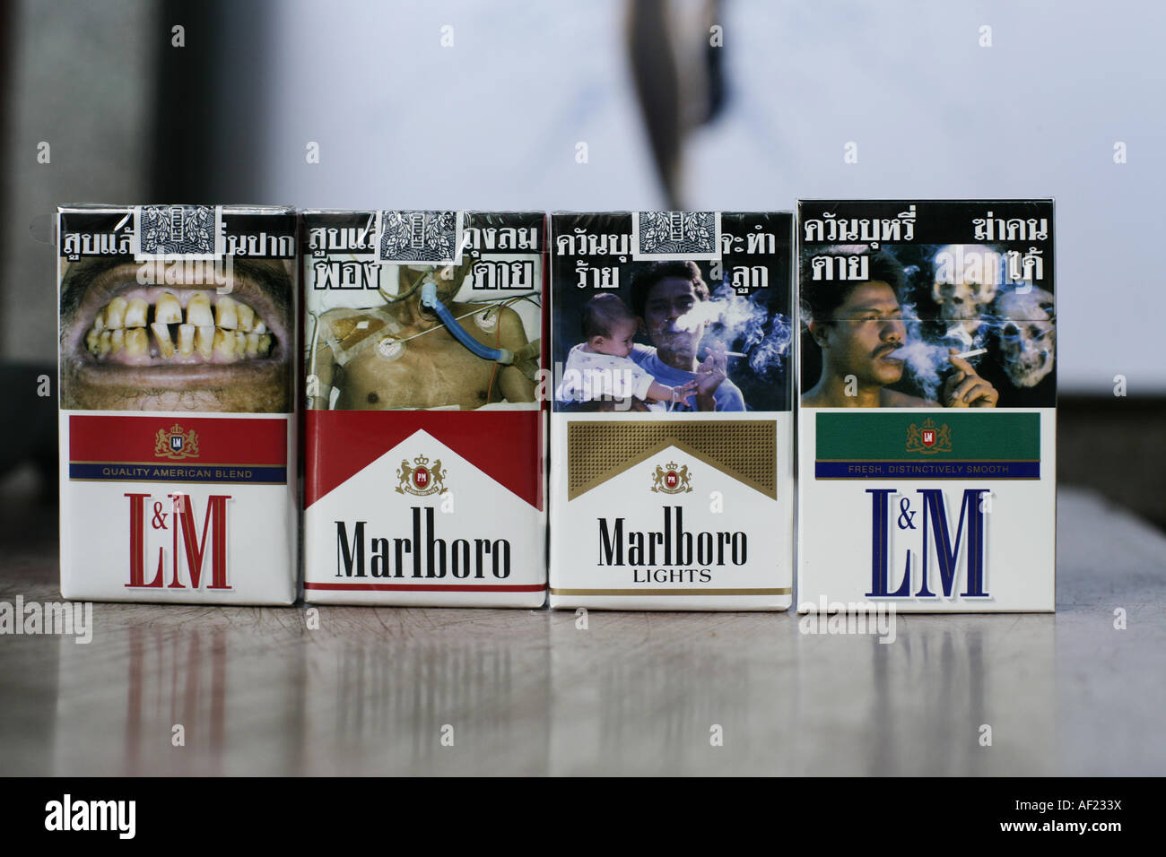 packages of  cigarettes with pictures of dead people, ill, cancer Stock Photo