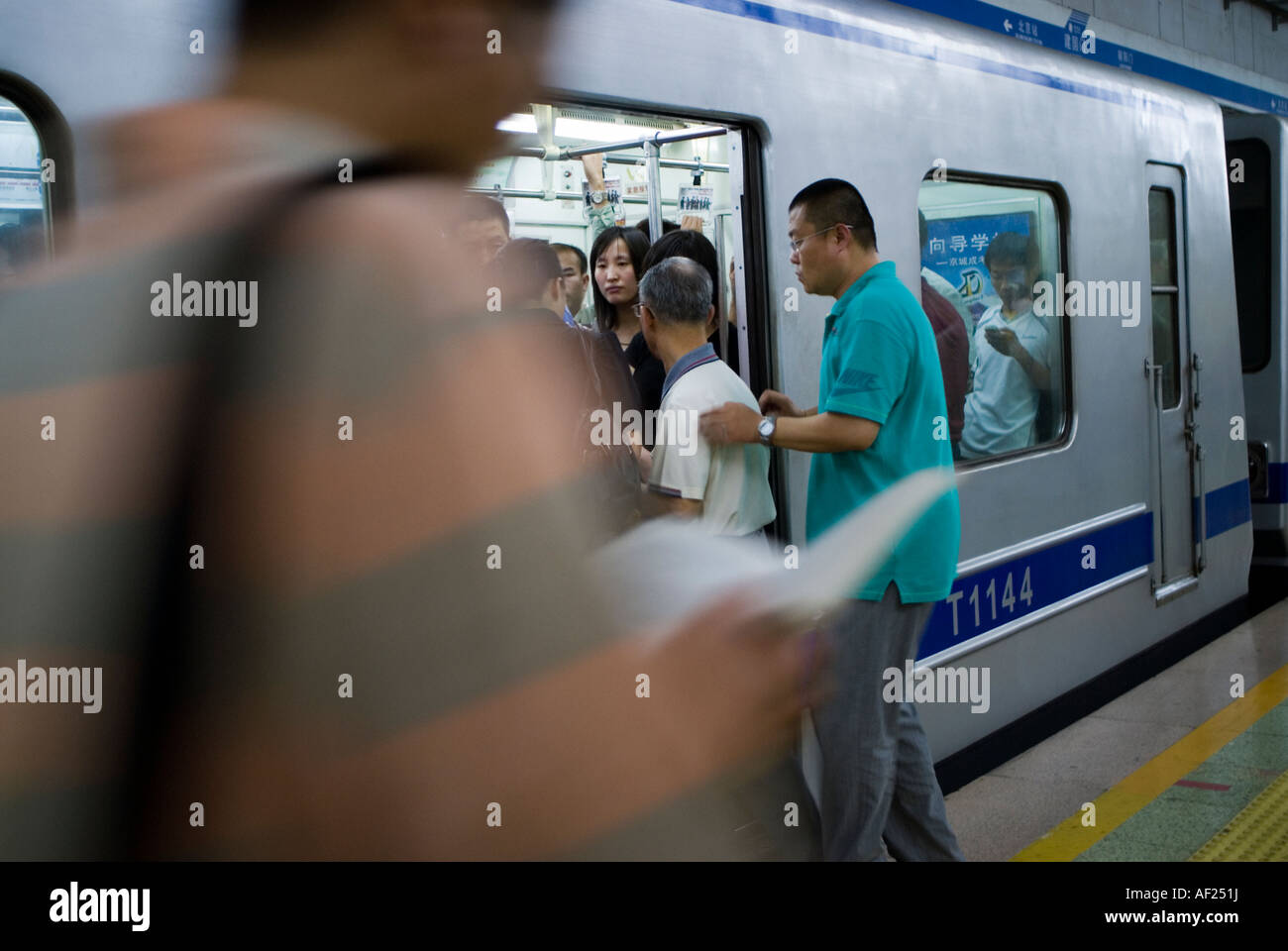 Beijing CHINA, Busy Subway Station Crowd of People Boarding Train, commute trains, get on train Stock Photo