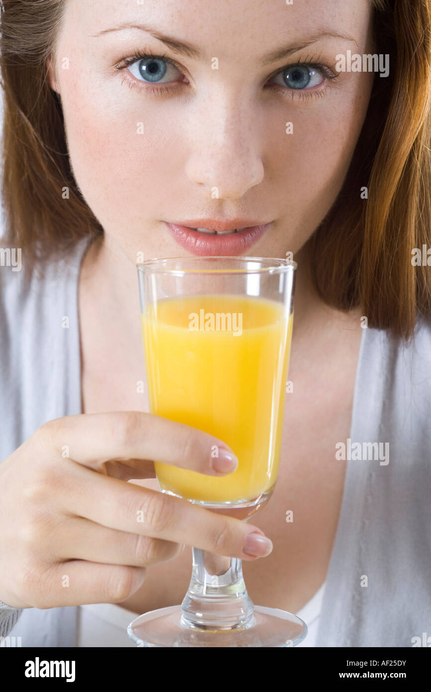 woman drinking orange juice Stock Photo Alamy
