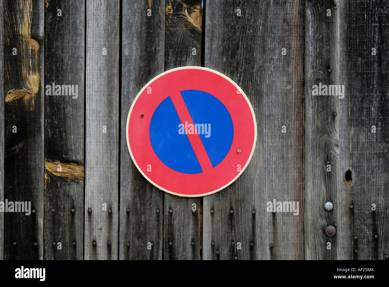 No Waiting sign on garage door, France. Stock Photo