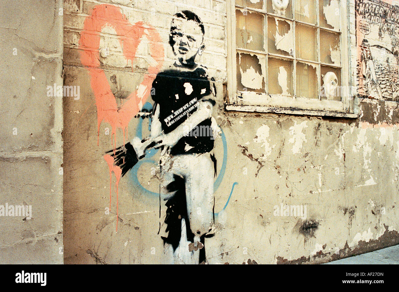 Stenciled Street Art By Graffiti Artist Banksy In Islington London Stenciled Street Art By Graffiti Artist Banksy In Islington London