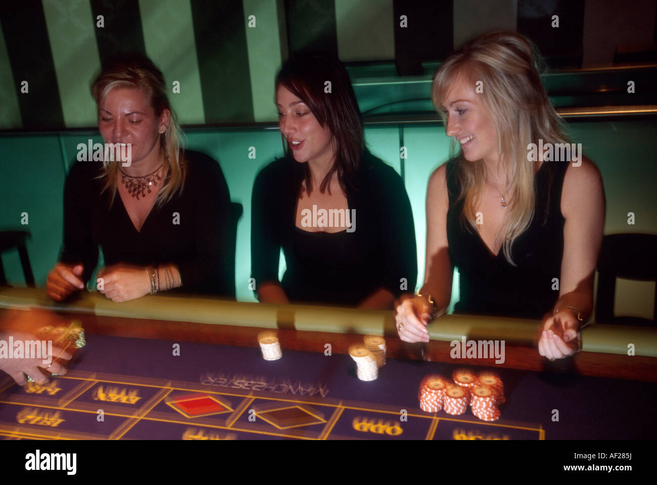 young women gamble at the the newly opened super casino that has been built under the new law regulating gambling and racing Stock Photo