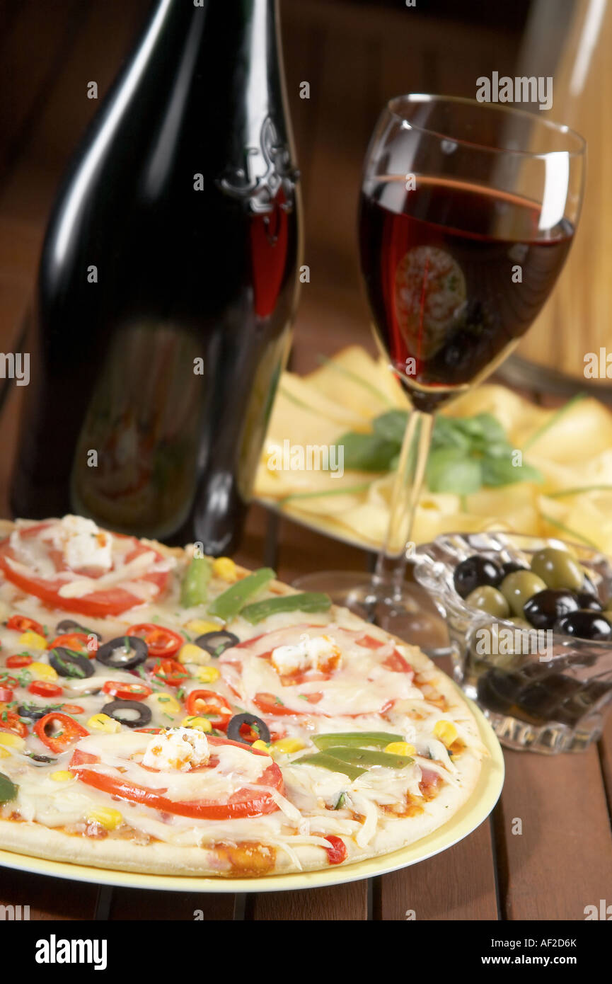 still life with red wine and pizza Stock Photo