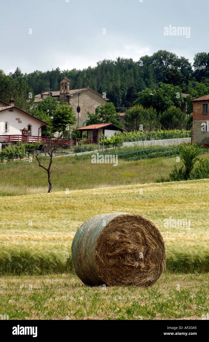A hay bale and a village church in rural Italy Stock Photo - Alamy