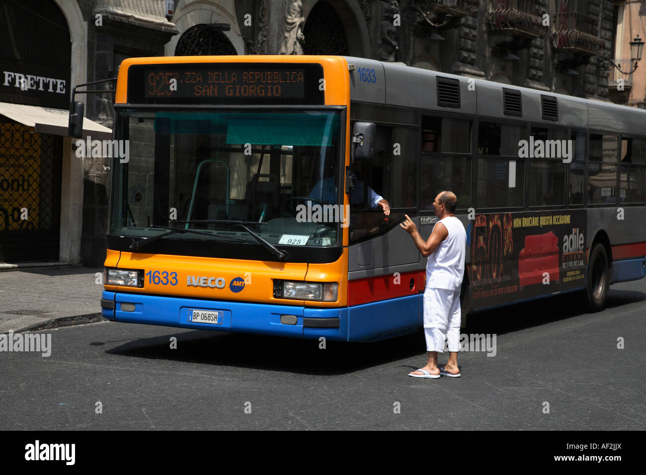 Man Asking for Directions from Bus Driver Catania Sicily Italy Stock Photo
