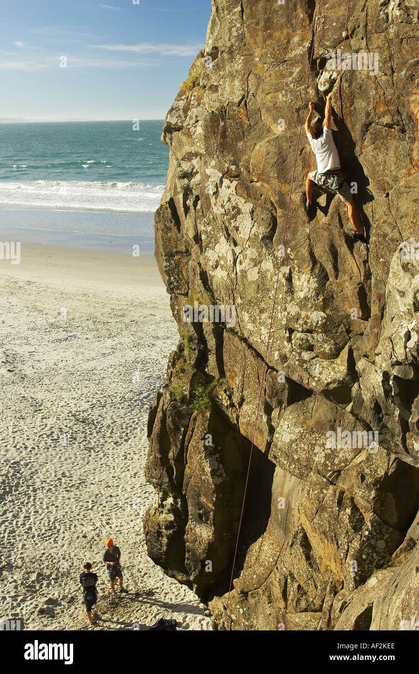Rock Climbing Long Beach near Dunedin South Island New Zealand Stock