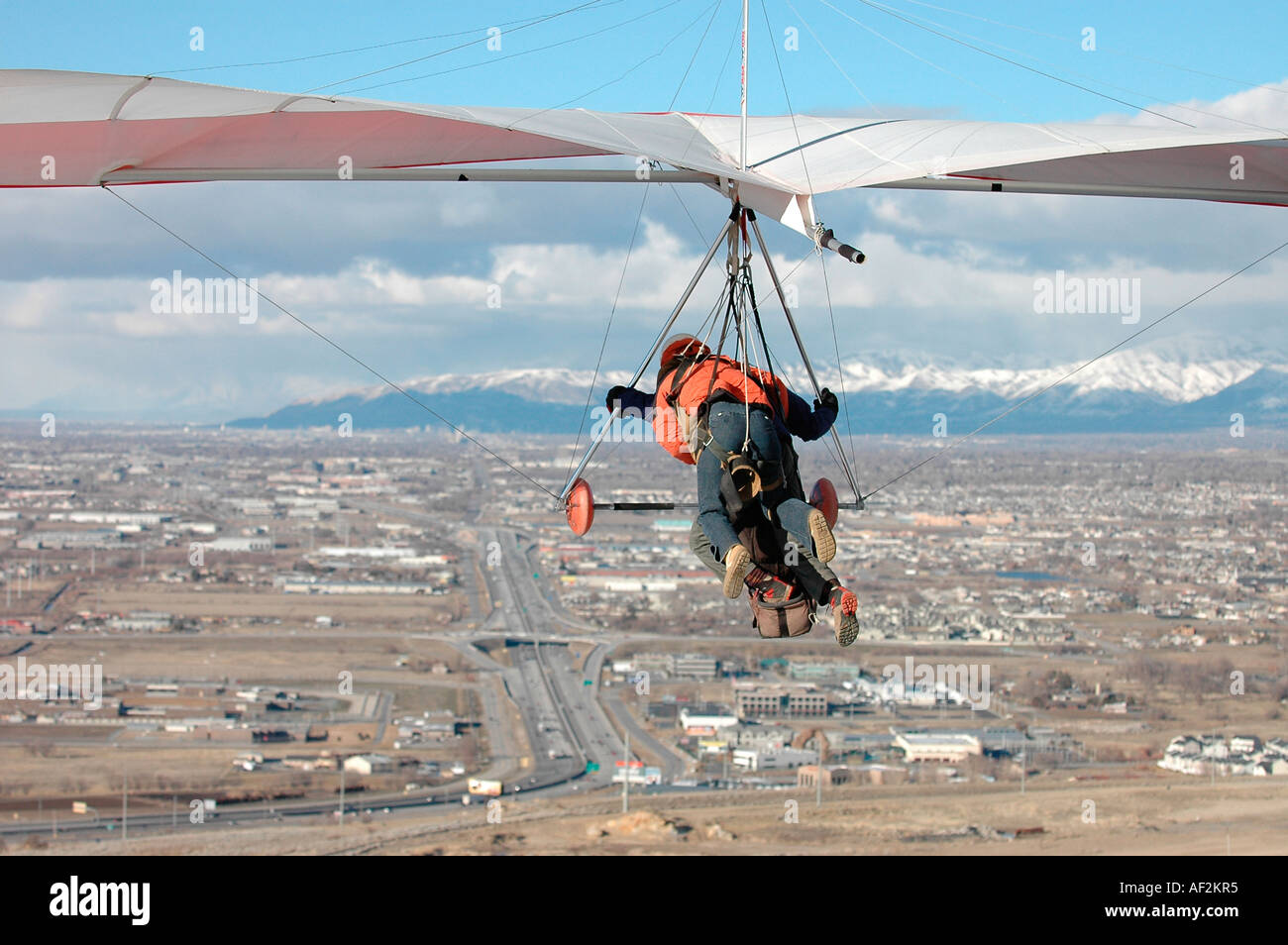 Hang gliding instructor and his student on take off to fly in tandem