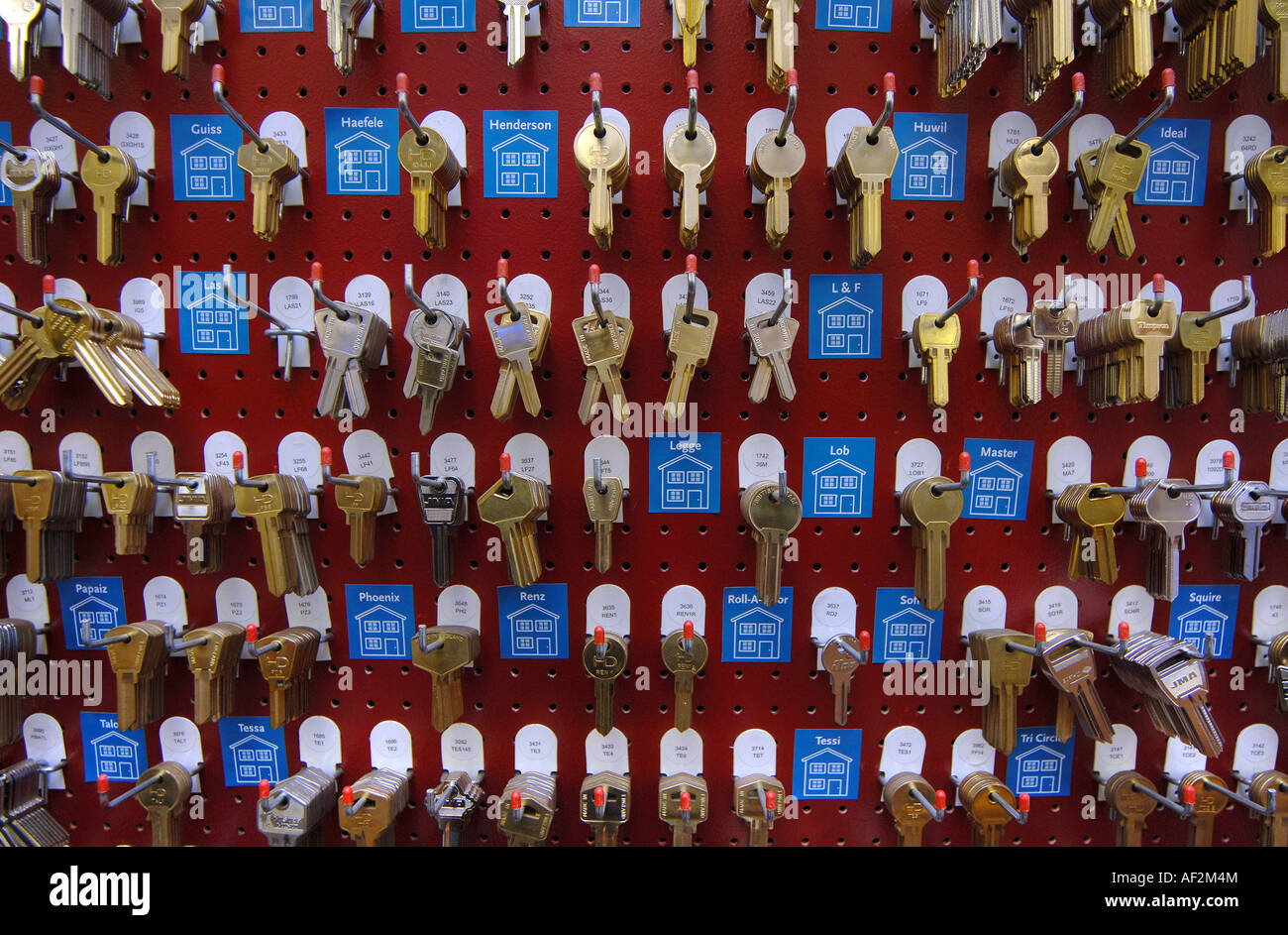 House keys hanging on hooks in a key cutting shop in Barnstaple, North