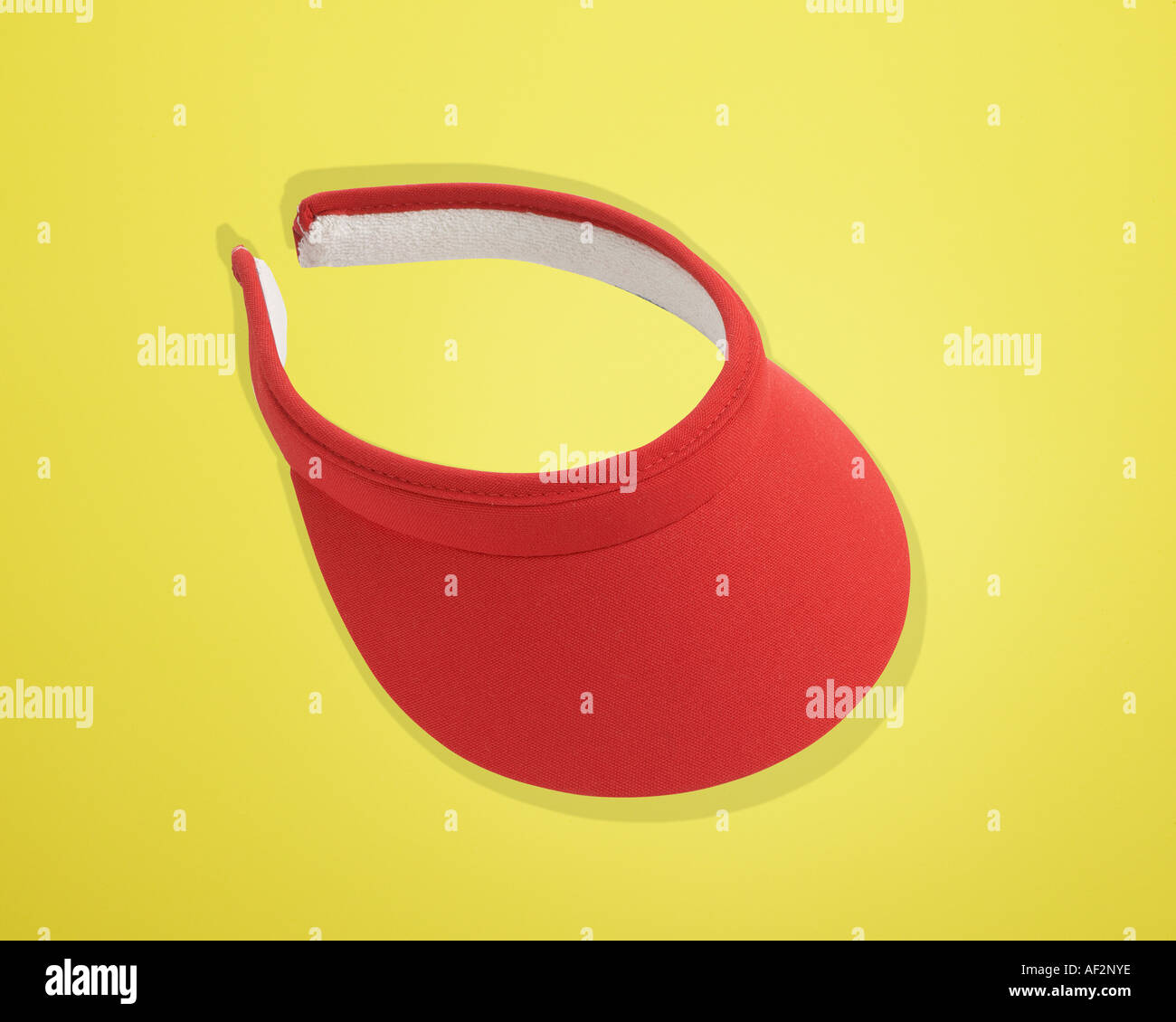 Red Rocket Stock Sun visor on color background with clipping path Stock Photo