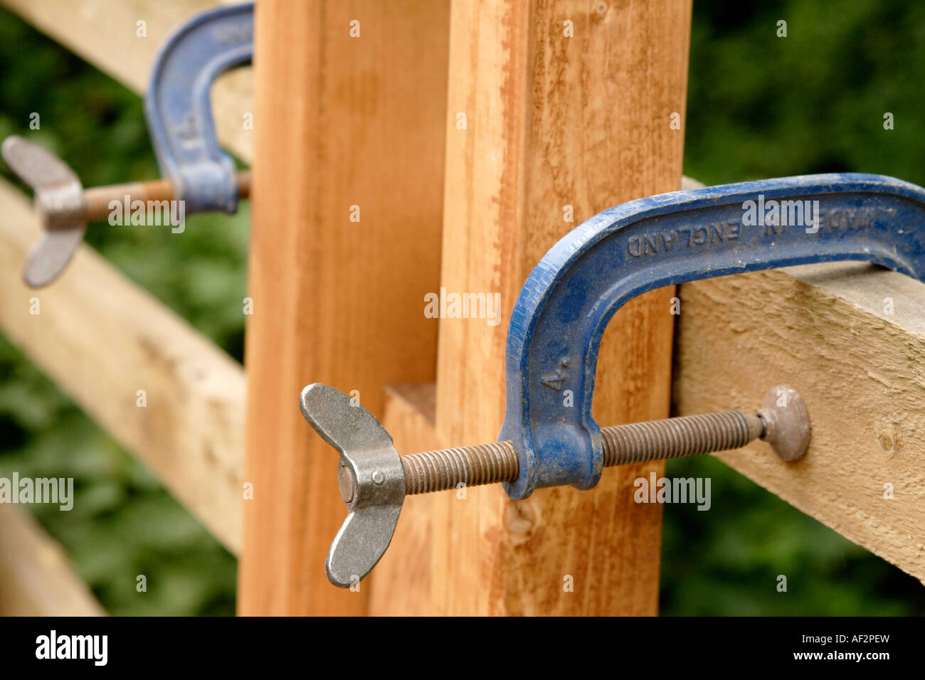 G clamp holding wood close up Stock Photo