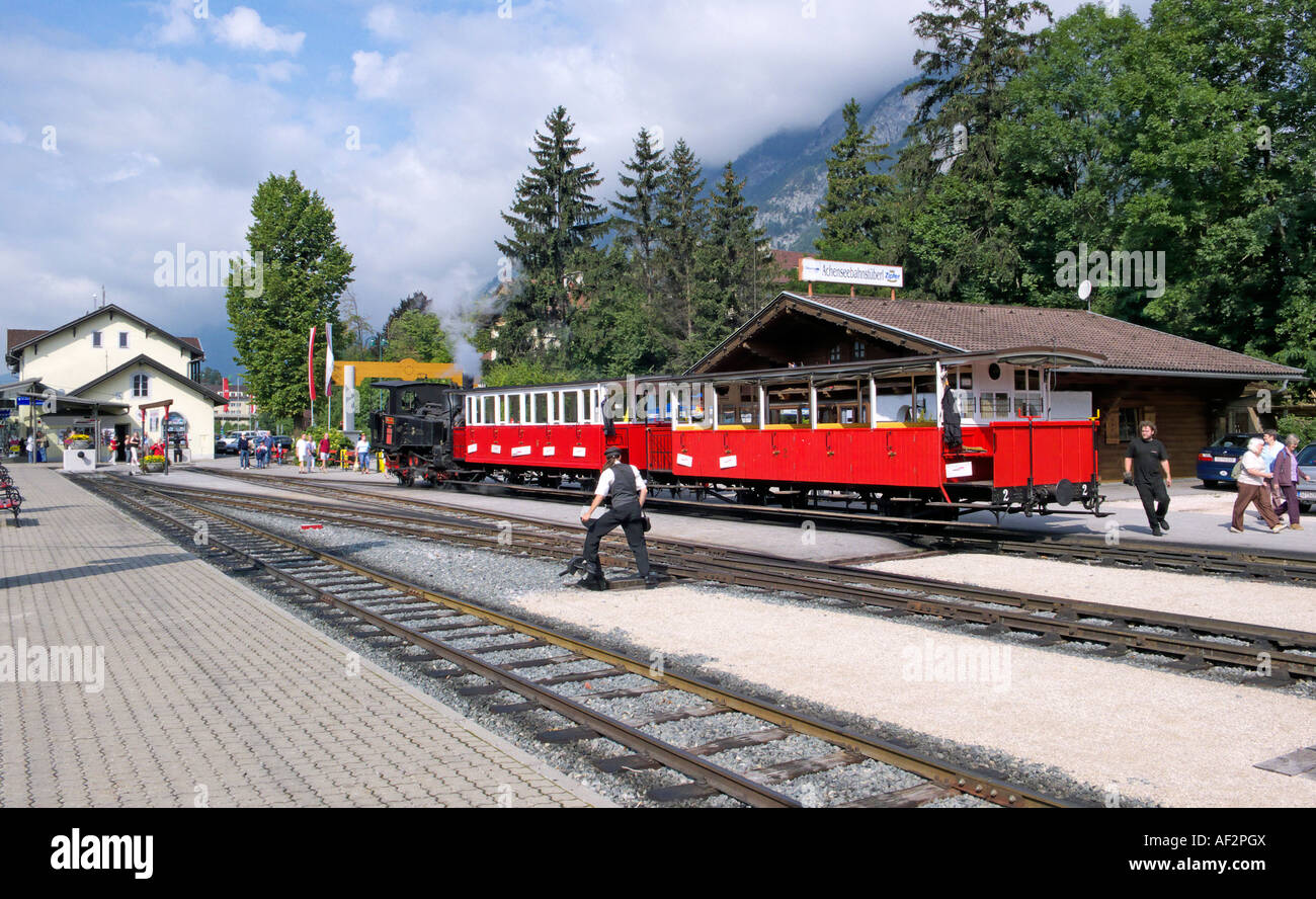 Steam train on Achenseebahn at Jenbach preparing to take on passengers for Auchensee in Austria Stock Photo