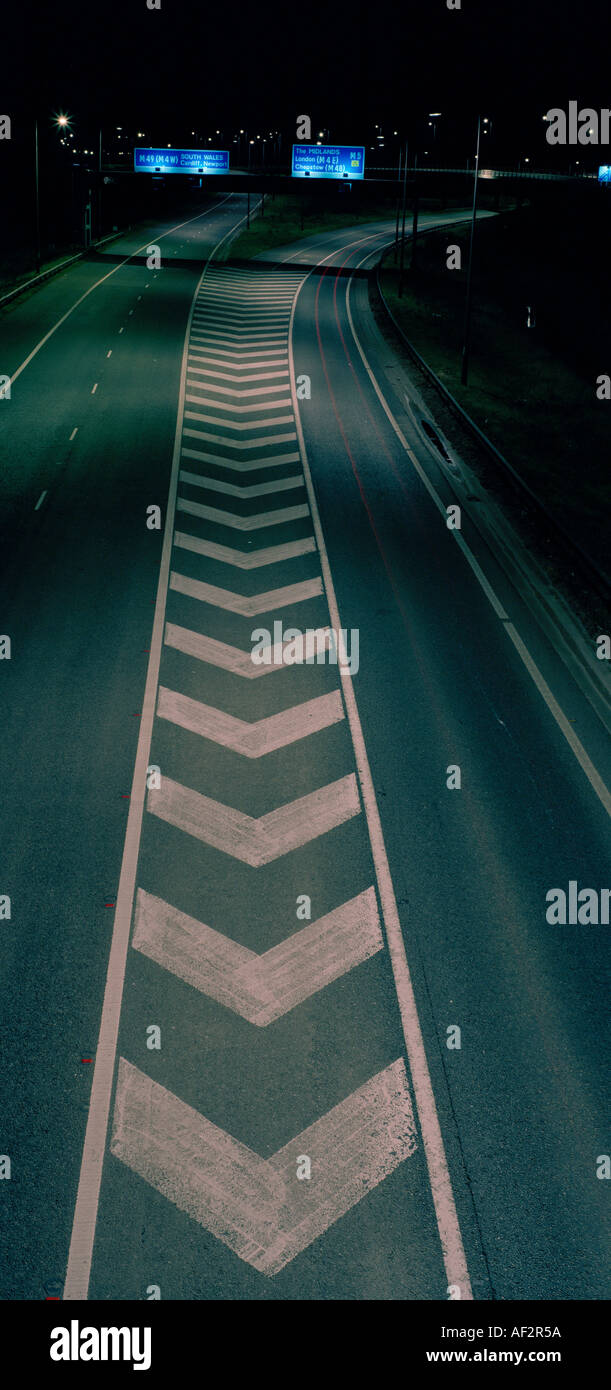 CHEVRON ROAD MARKING AT NIGHT UK Stock Photo