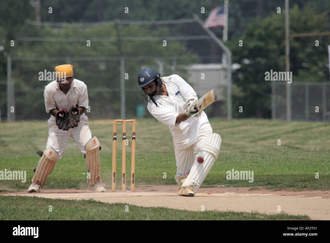 Cricket batsmen hits the ball Stock Photo Alamy