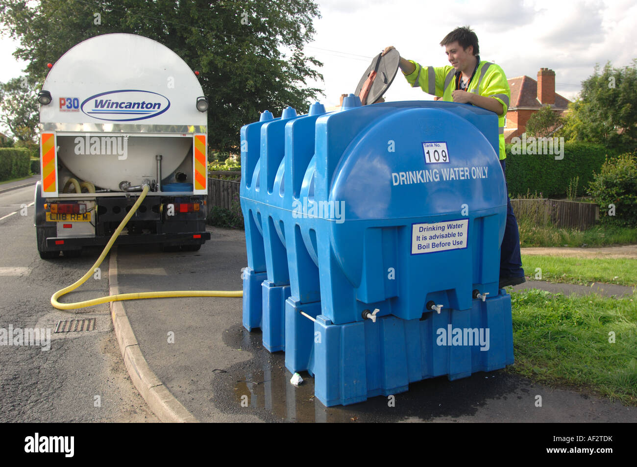 Refilling water tank or bowser in the Longlevens area of Gloucester England July 2007 following