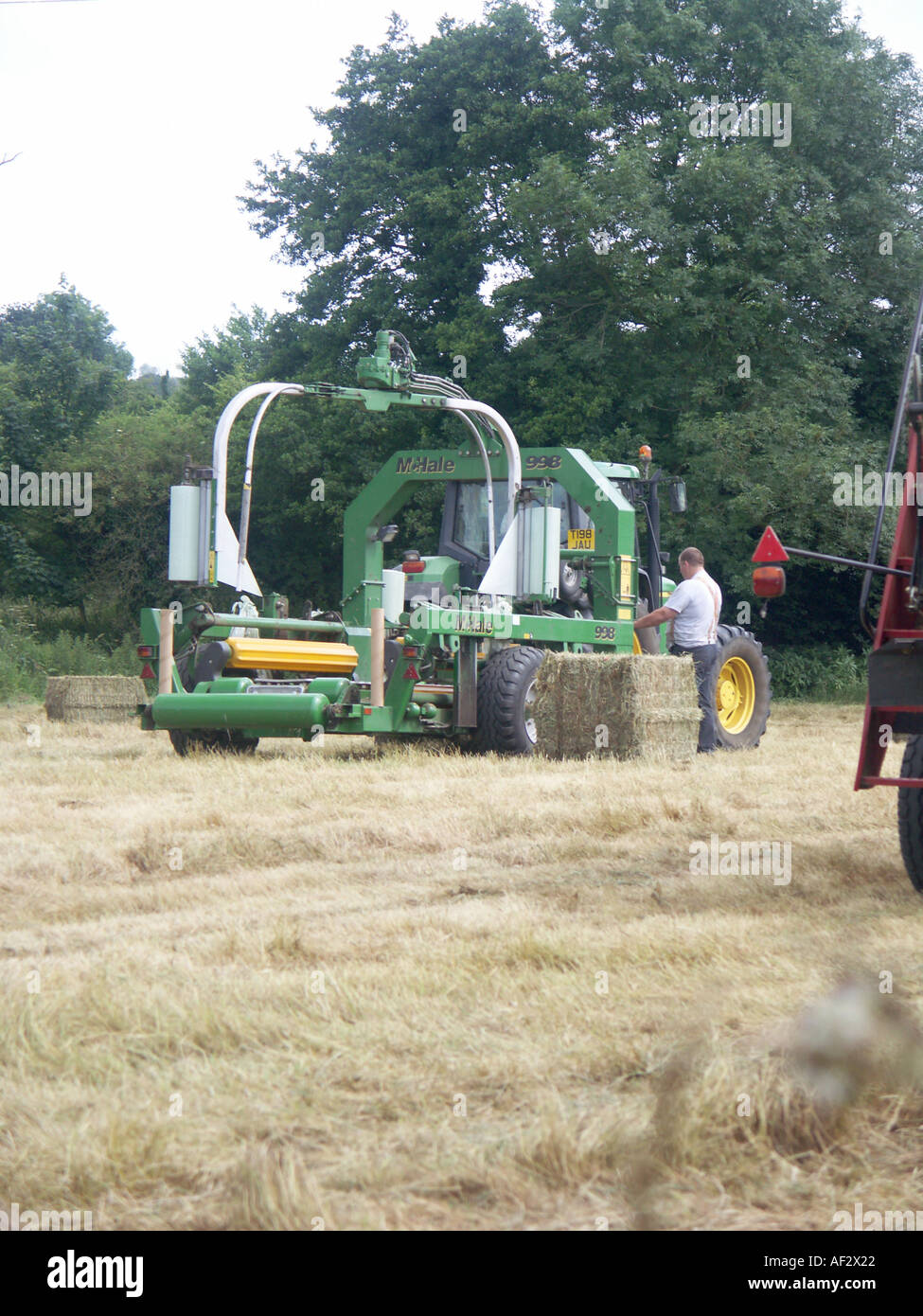 Hay bale wrapping machine hires stock photography and images Alamy