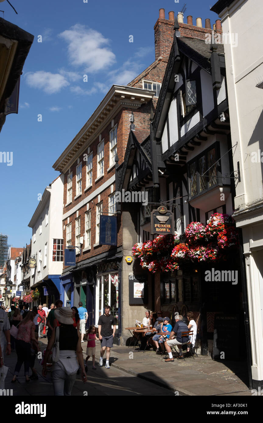 HANGING BASKETS WITH FLOWERS OUT SIDE PUNCH BOWL INN ON STONEGATE