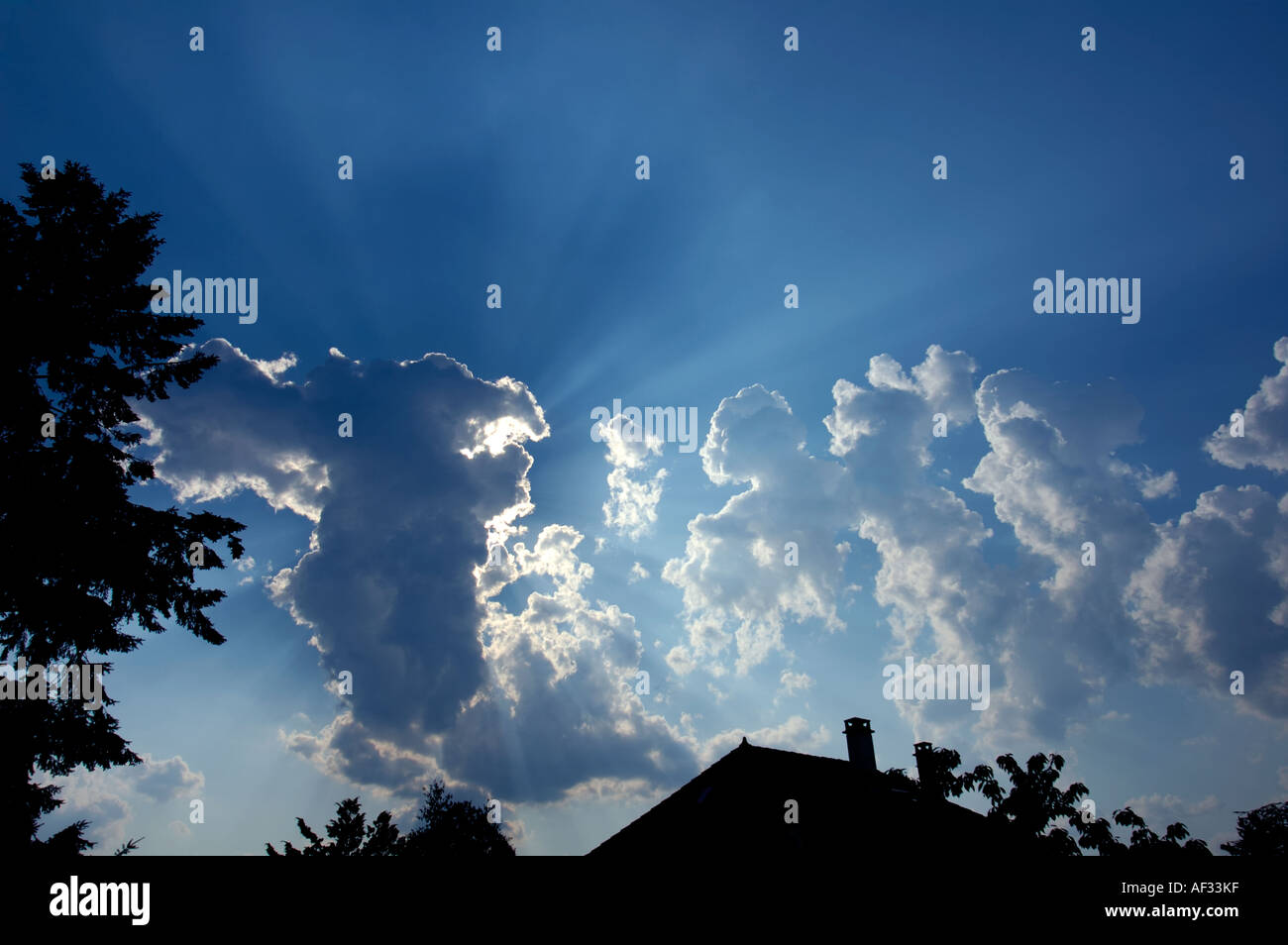 Silver Rays Sky Fluffy clouds sun rays silver hi-res stock photography and images - Alamy