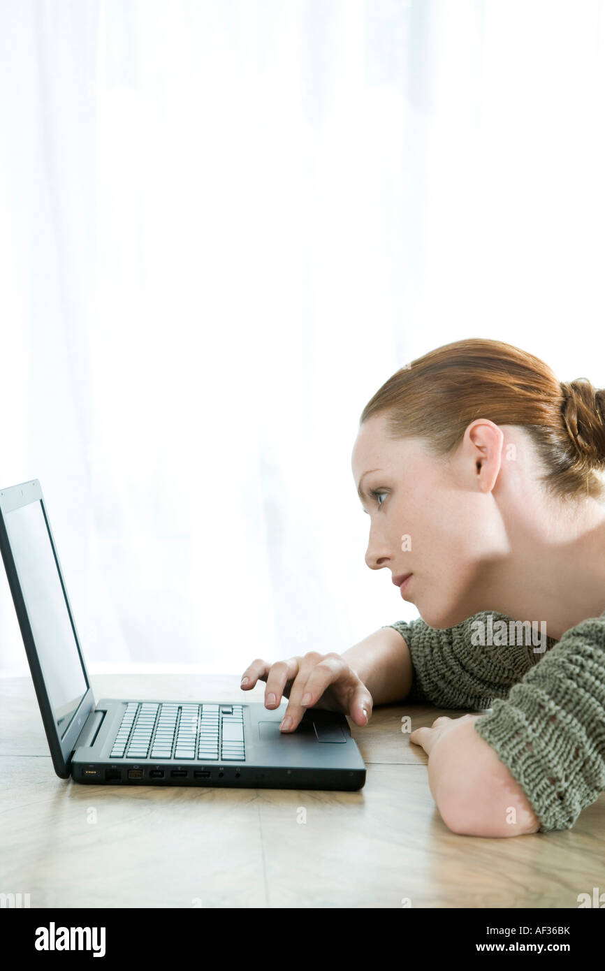 young woman using laptop Stock Photo - Alamy