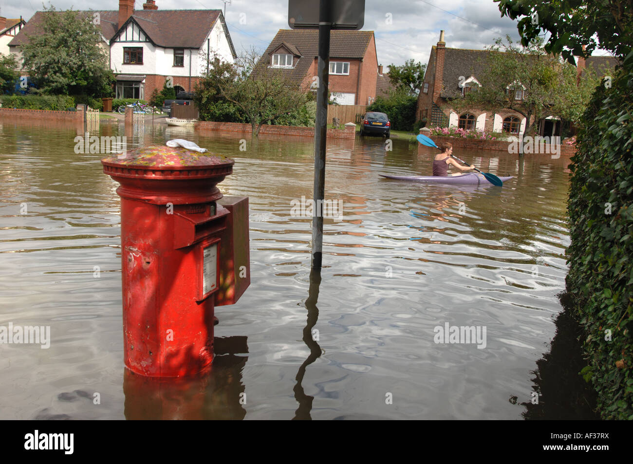 A flooded road and letter box in the Longford area of Gloucester England July 2007 following
