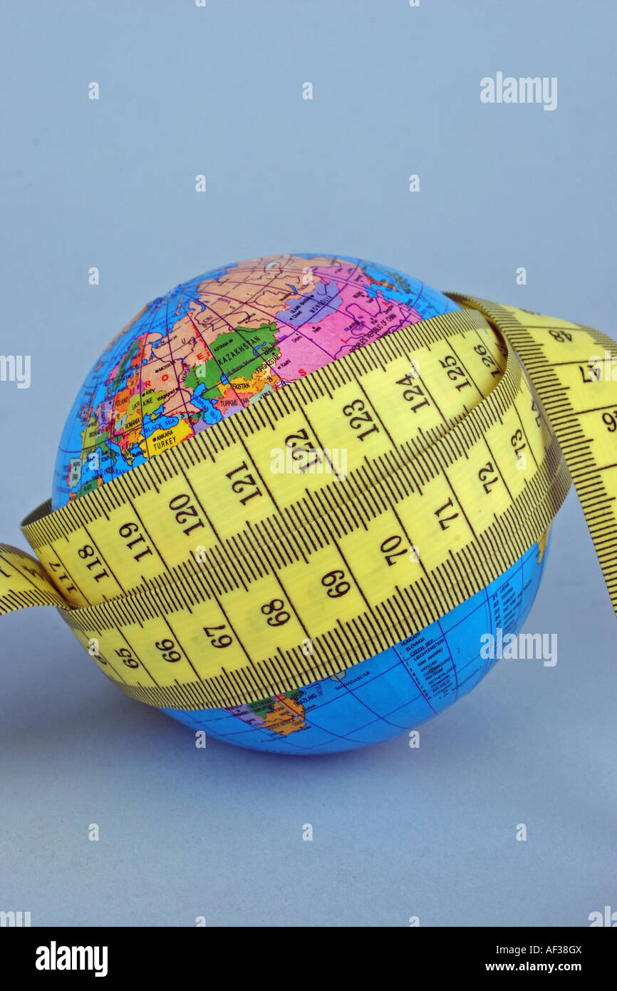 a globe and a tape measure Stock Photo