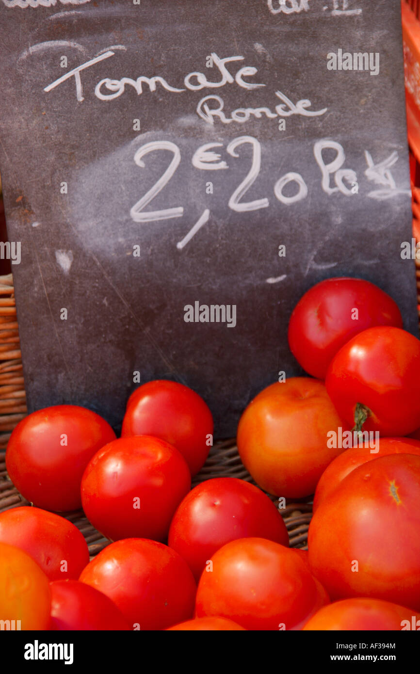 Bright red tomatoes for sale at a market in for sale in the Languedoc ...