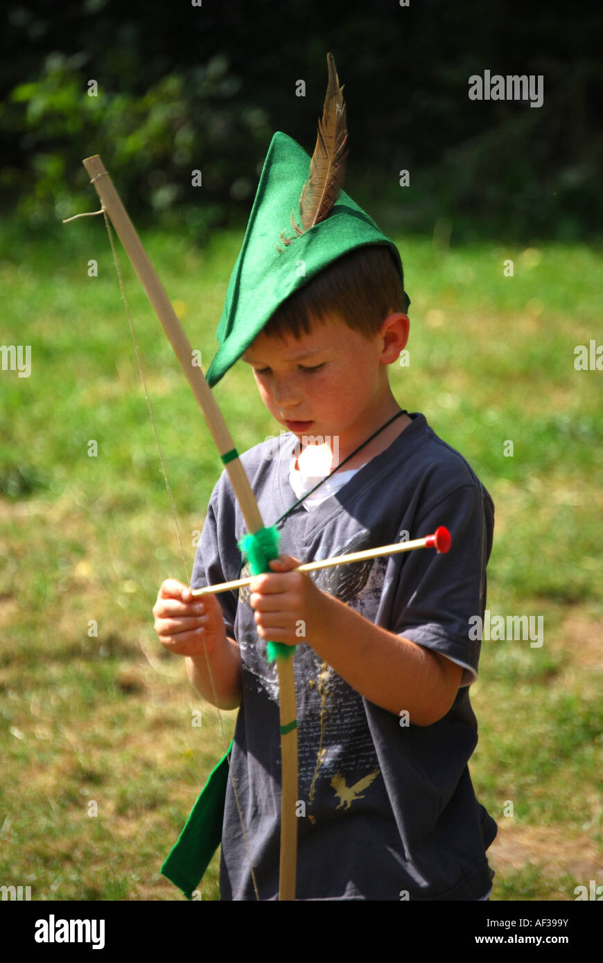 Boy with green hat and bow and arrow, Robin Hood Festival, Sherwood Forest, Nottinghamshire, England, United Kingdom Stock Photo