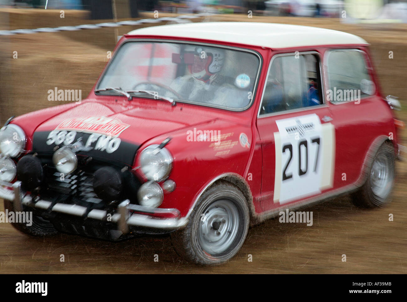 1964 Mini Cooper S, driver Rauno Aaltonen at the rally stage paddock at the Goodwood Festival of Speed, Sussex, UK. Stock Photo