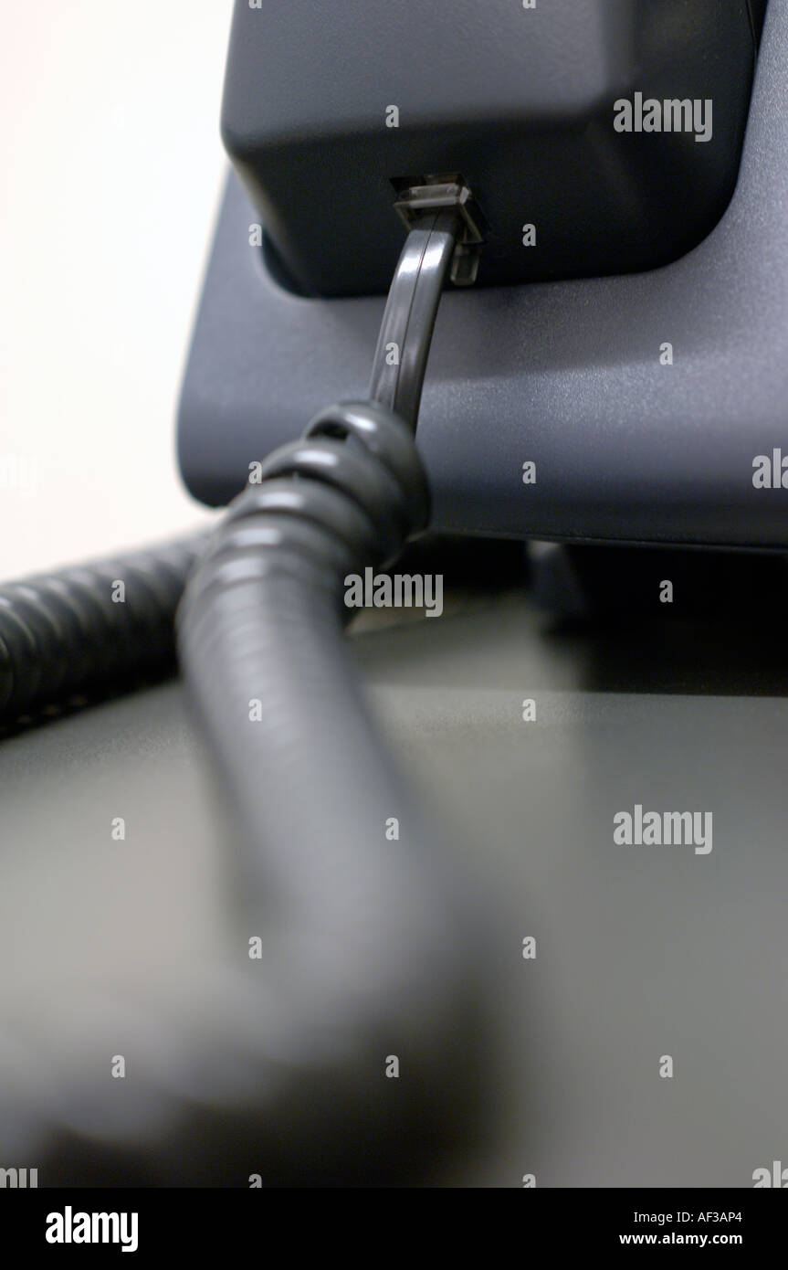 Close-up of telephone cord attached to handset Stock Photo