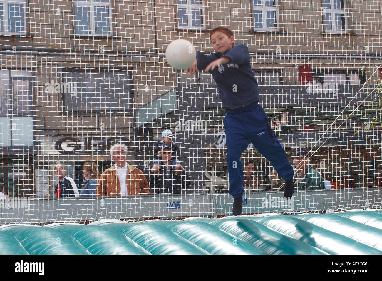 Event in Hamburg's marketplace because of FIFA 2006. Children trying their luck hand at footnall play. Stock Photo