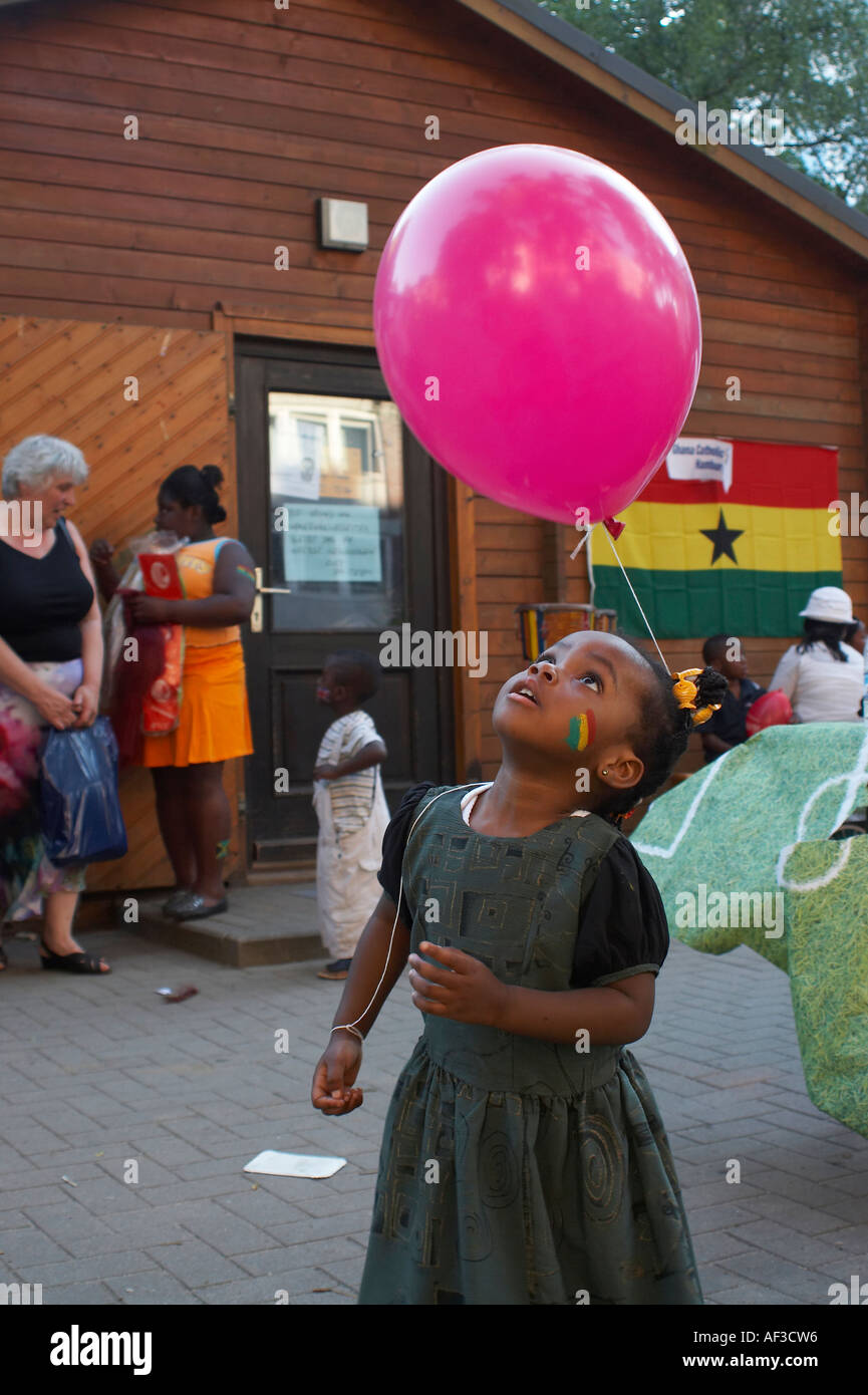 World Cup Festival of the people and cultures. Little girl from Ghana playing with a baloon Stock Photo