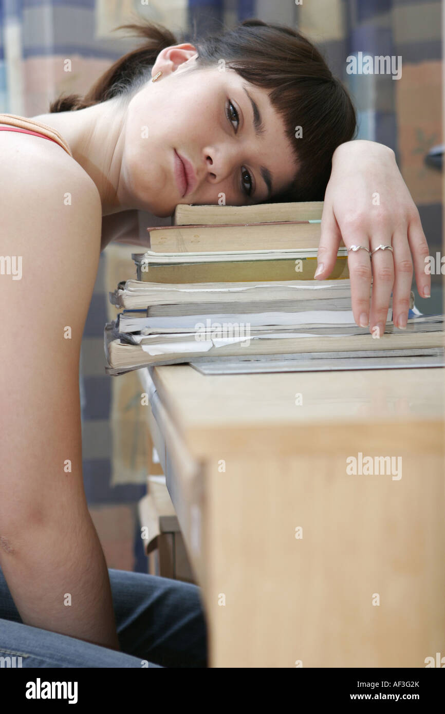 Studing teenager girl with many books Stock Photo