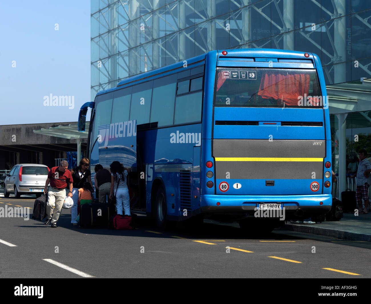 Catania Airport Sicily Collecting Suitcases from A Bus Stock Photo