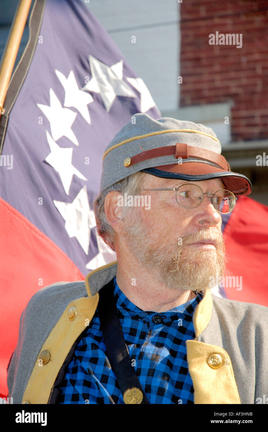 American Civil War reenactor with Confederate Flag Stock Photo