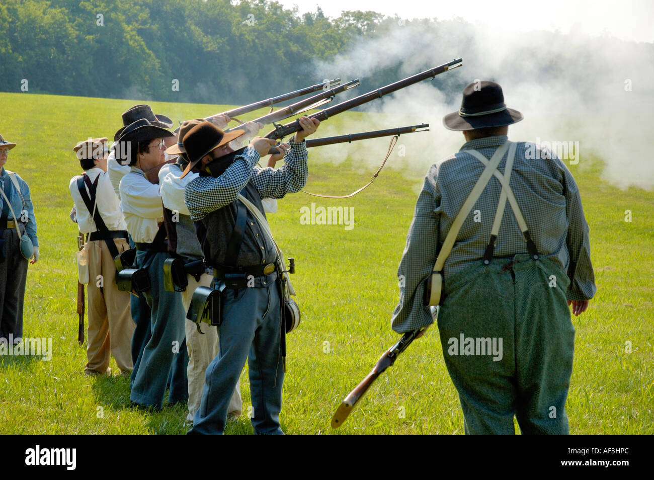 Confederate infantry reenactors practicing firing rifles Stock Photo