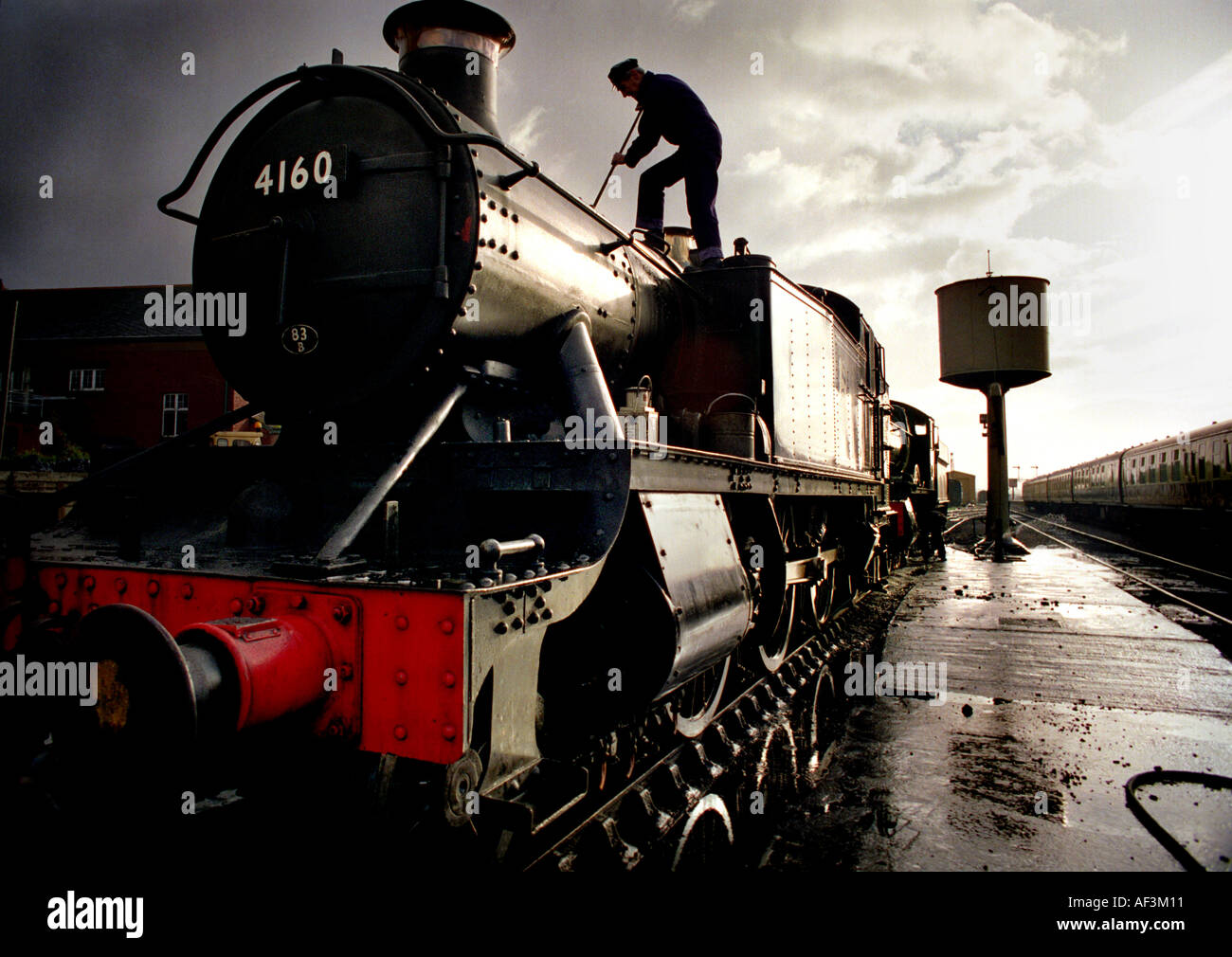 Cleaning an engine at the West Somerset Railway Minehead UK Stock Photo ...
