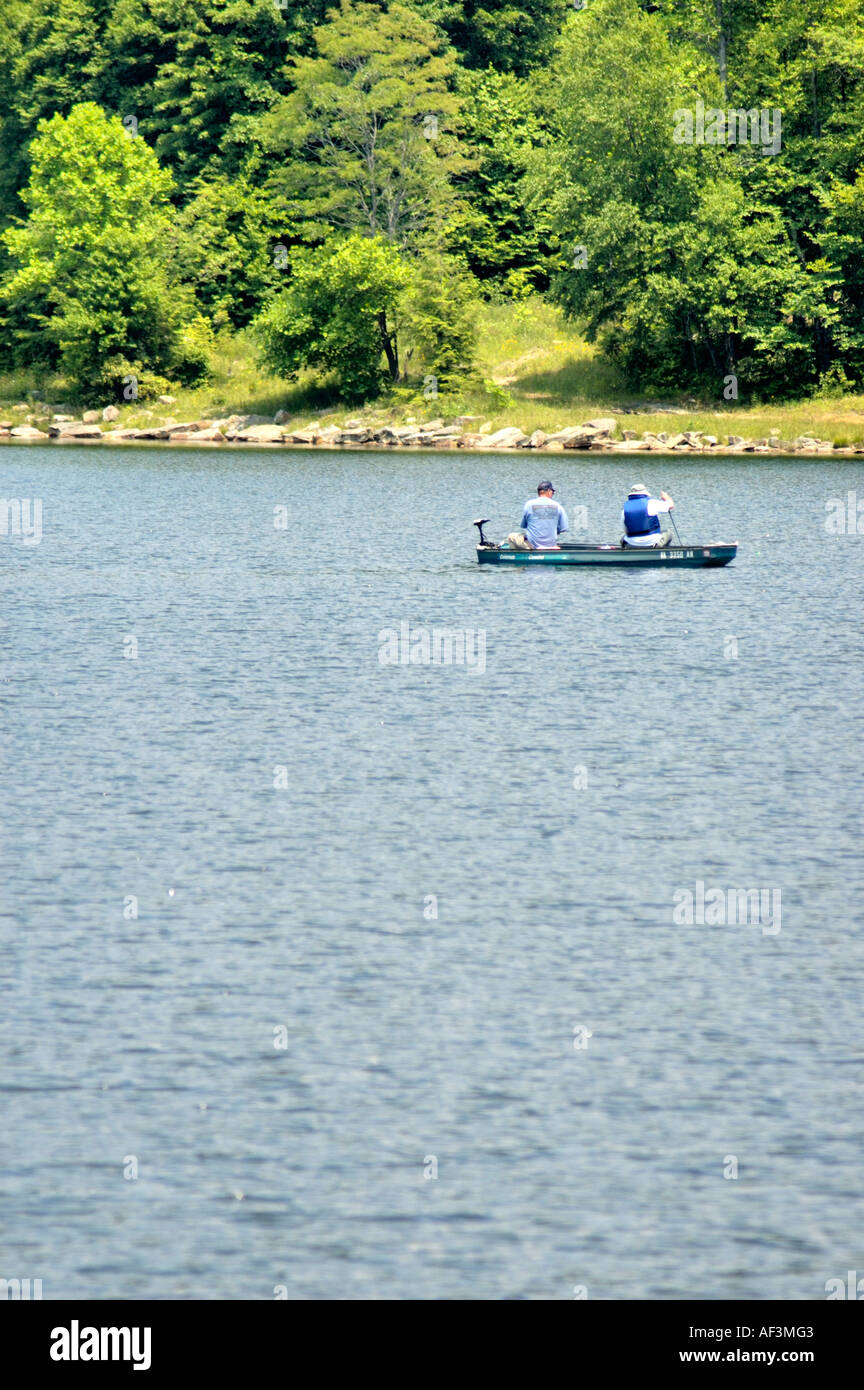 Fisherman in boat on lake hi-res stock photography and images - Alamy