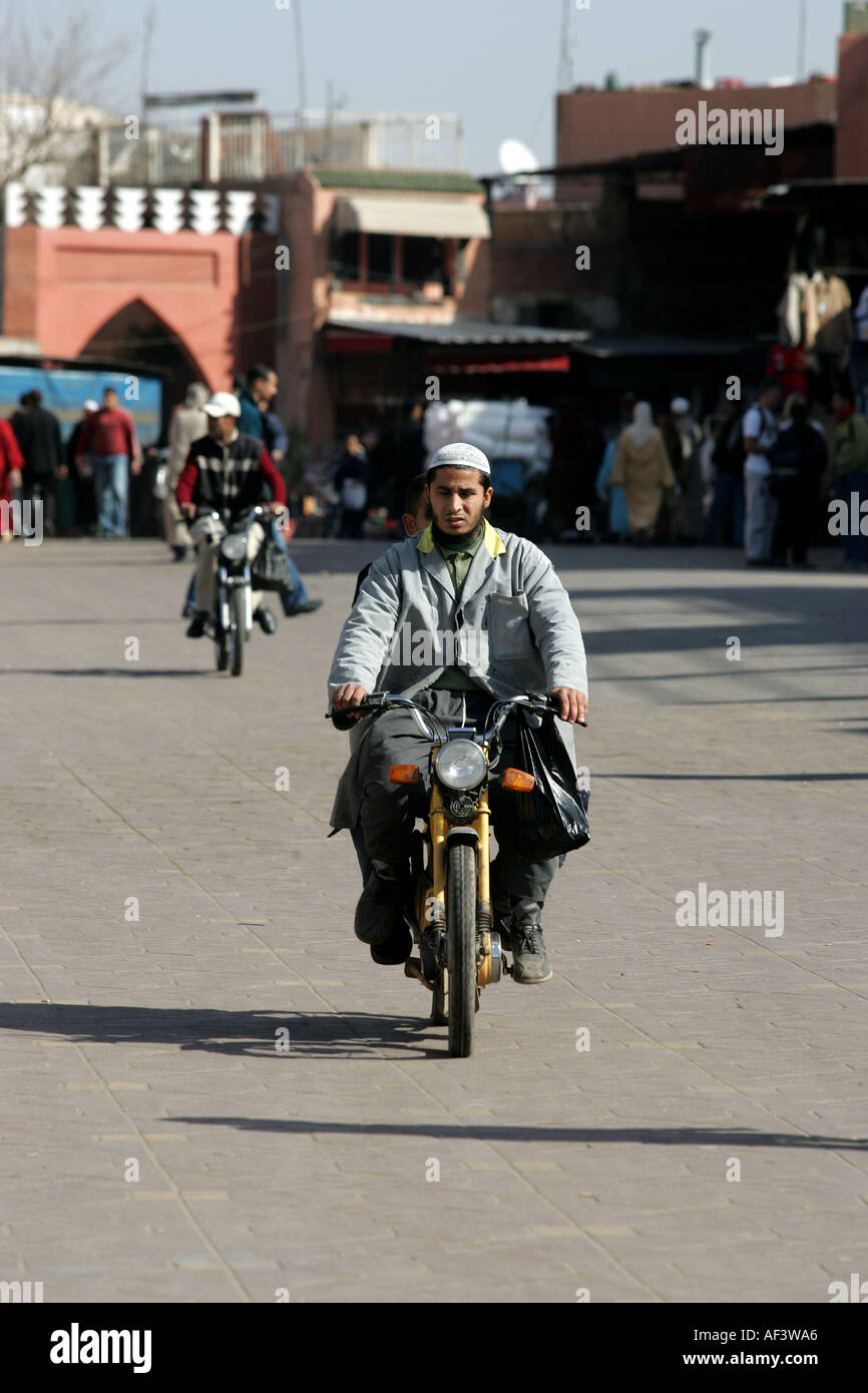 marrakech main square medina a modern motorcycle rides through the main square Stock Photo