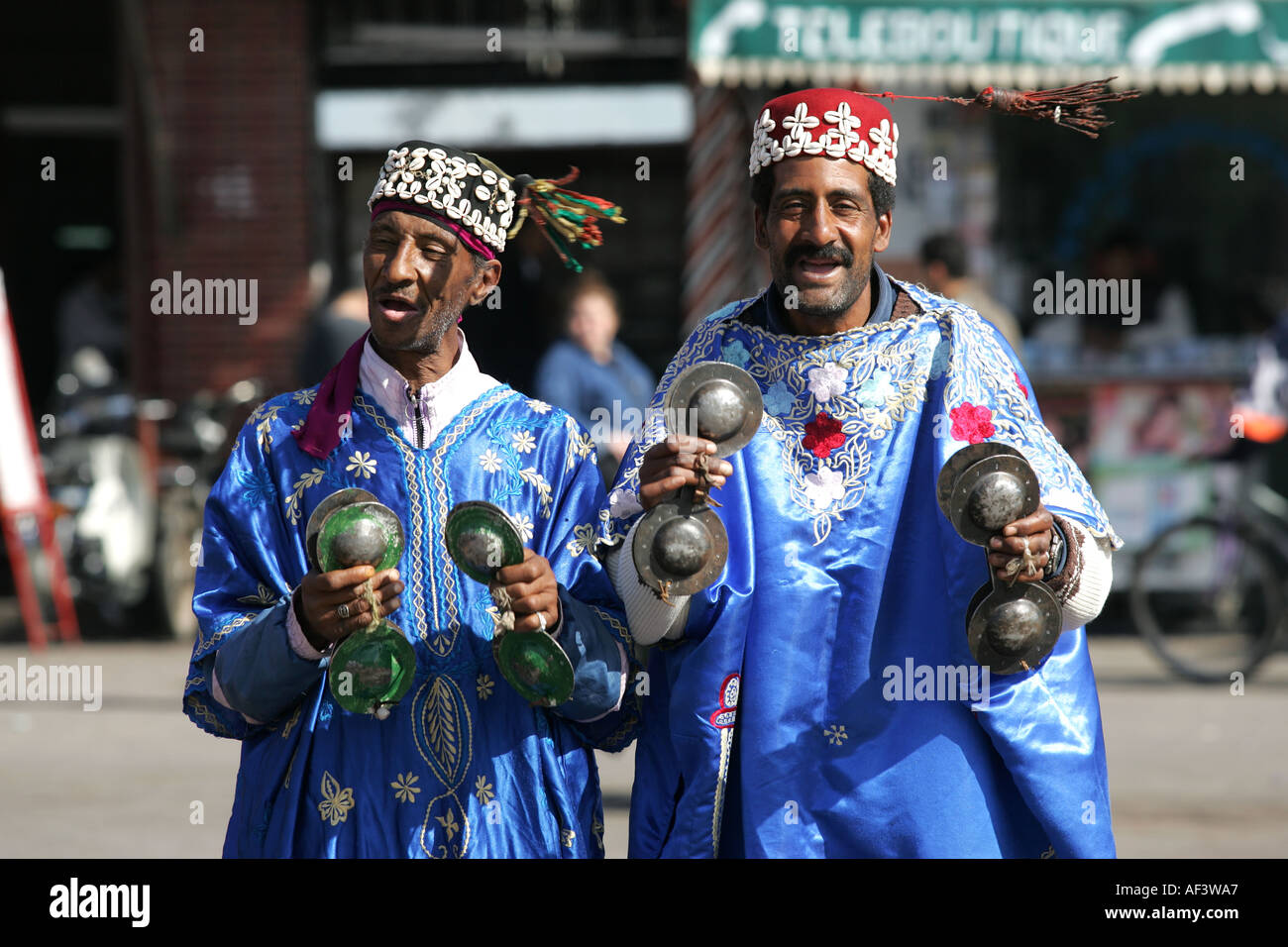 men in traditional dress in Marrakech s main square Stock Photo