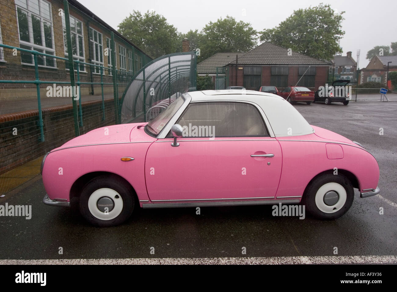 Pink and white two tone Nissan Figaro classic cult car japan Stock